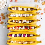 Campfire banana boats, lined up on a plate.