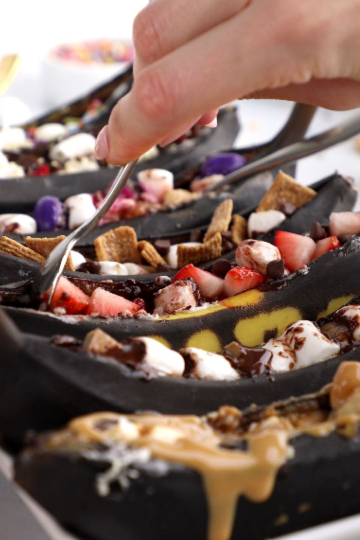 Campfire banana boats, scooped up with a utensil.