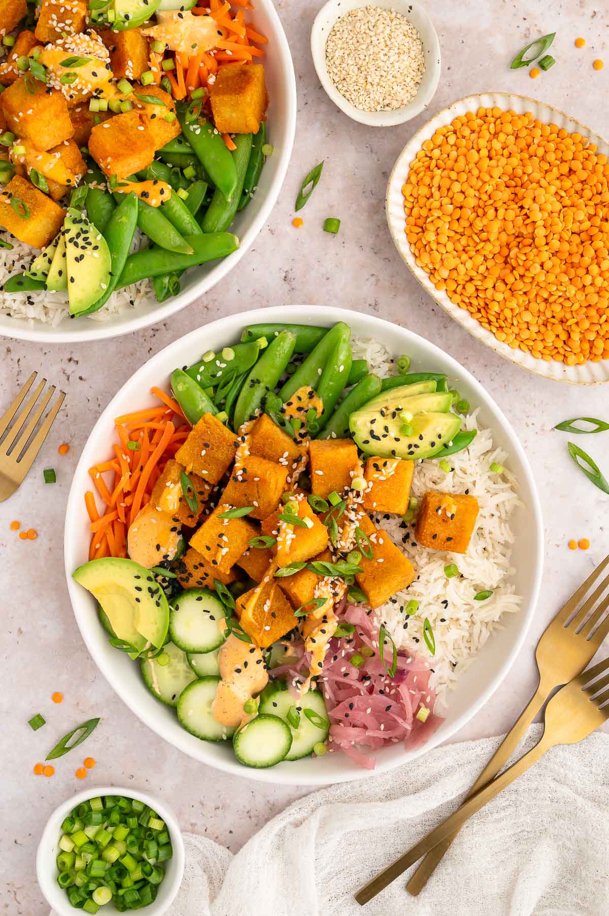 Red lentil tofu cubes on a salad.