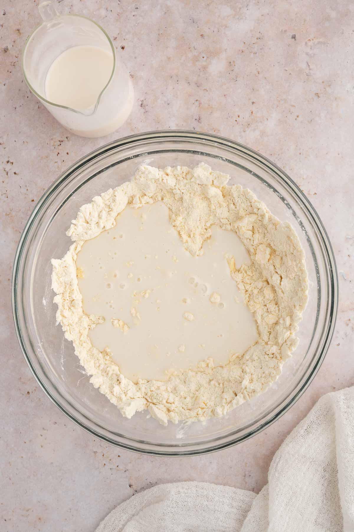 Flour and plant-based milk in a bowl.