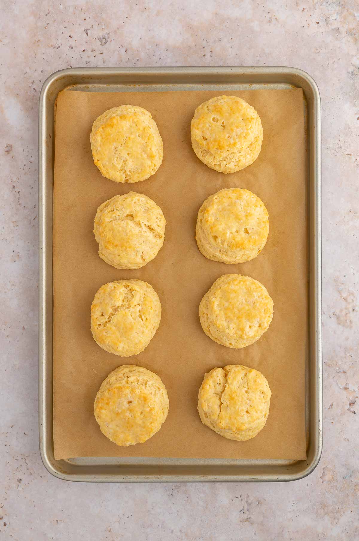 Baked vegan biscuits on a baking sheet.