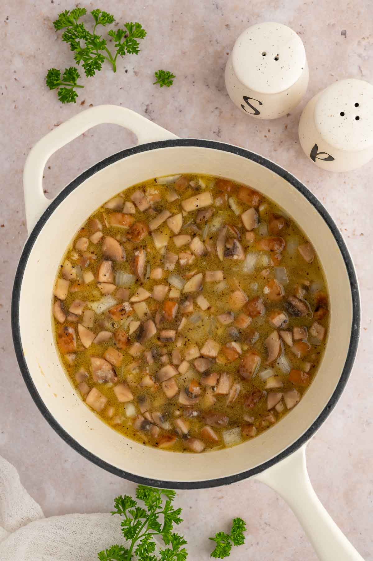 Chopped mushrooms in a pot.