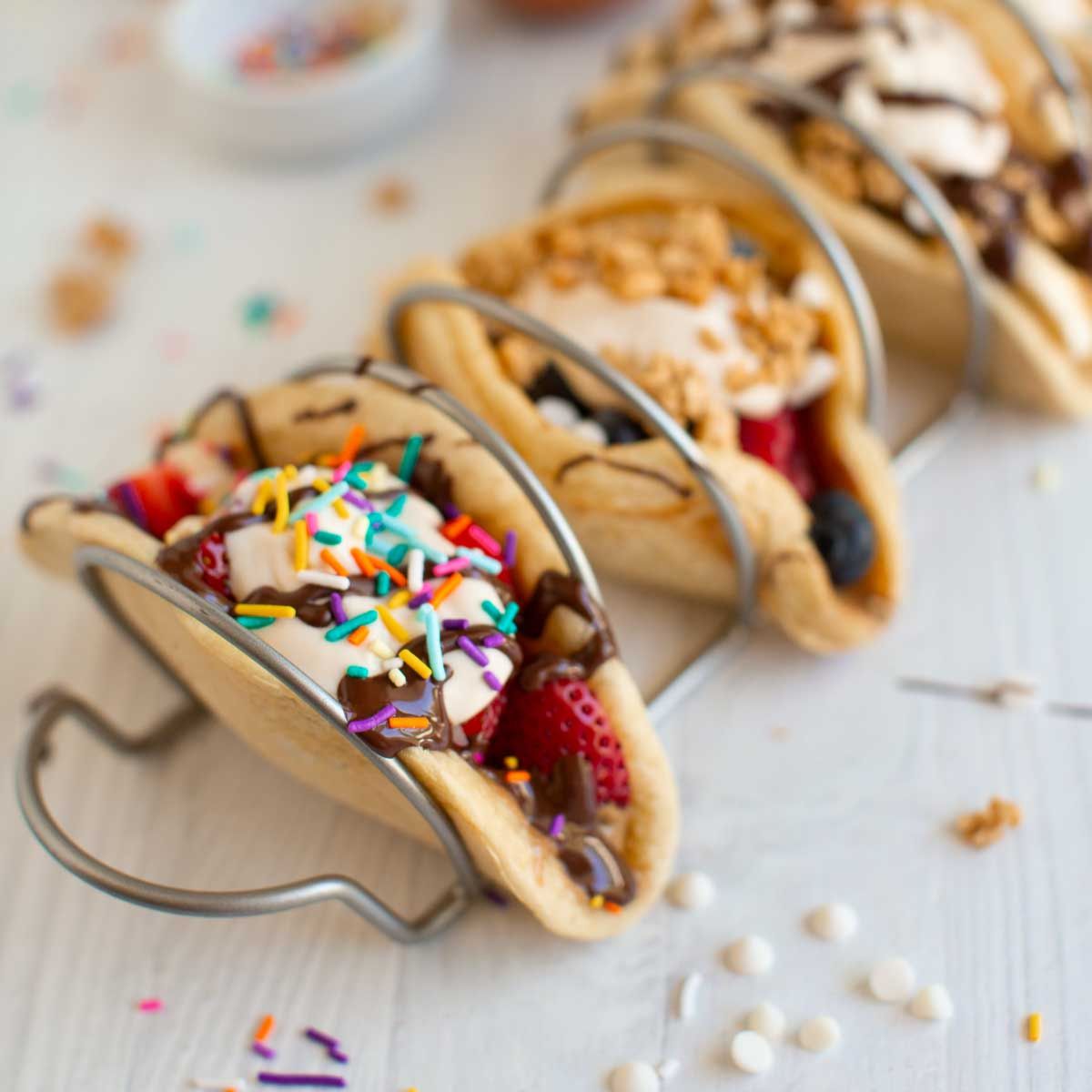 A colorful pancake taco in a taco holder.