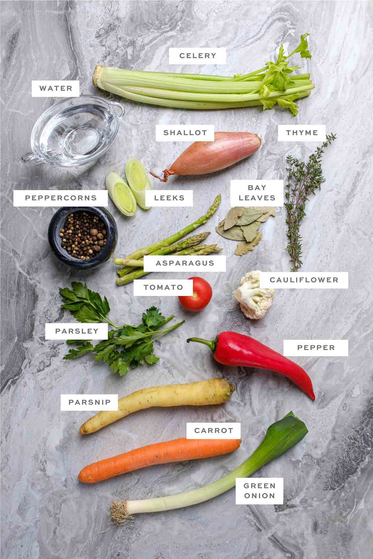 Key ingredients for homemade vegan broth with labels.
