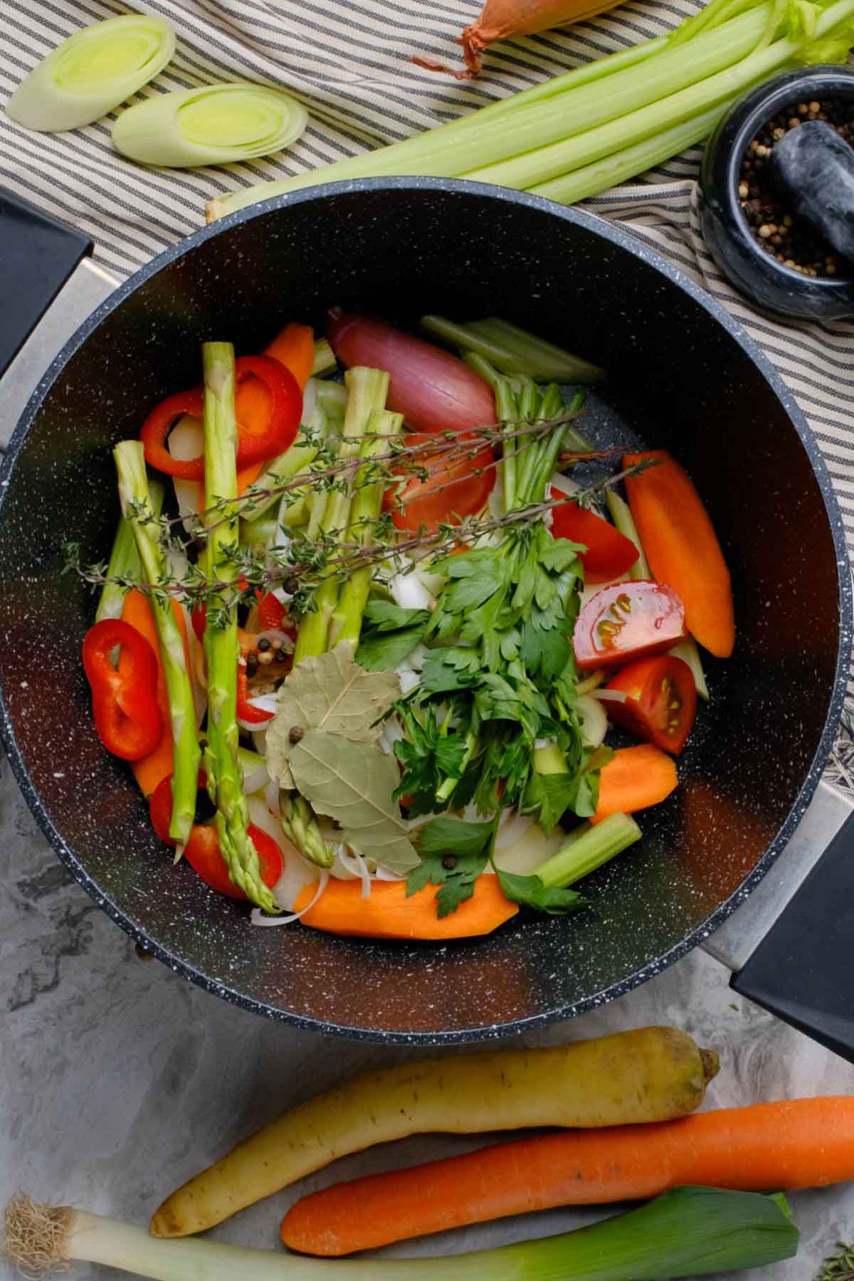A pot filled with vegetable scraps.