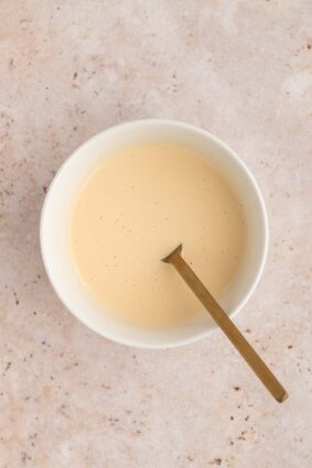 The cornstarch, lemon juice, and vanilla extract all mixed together in a bowl.