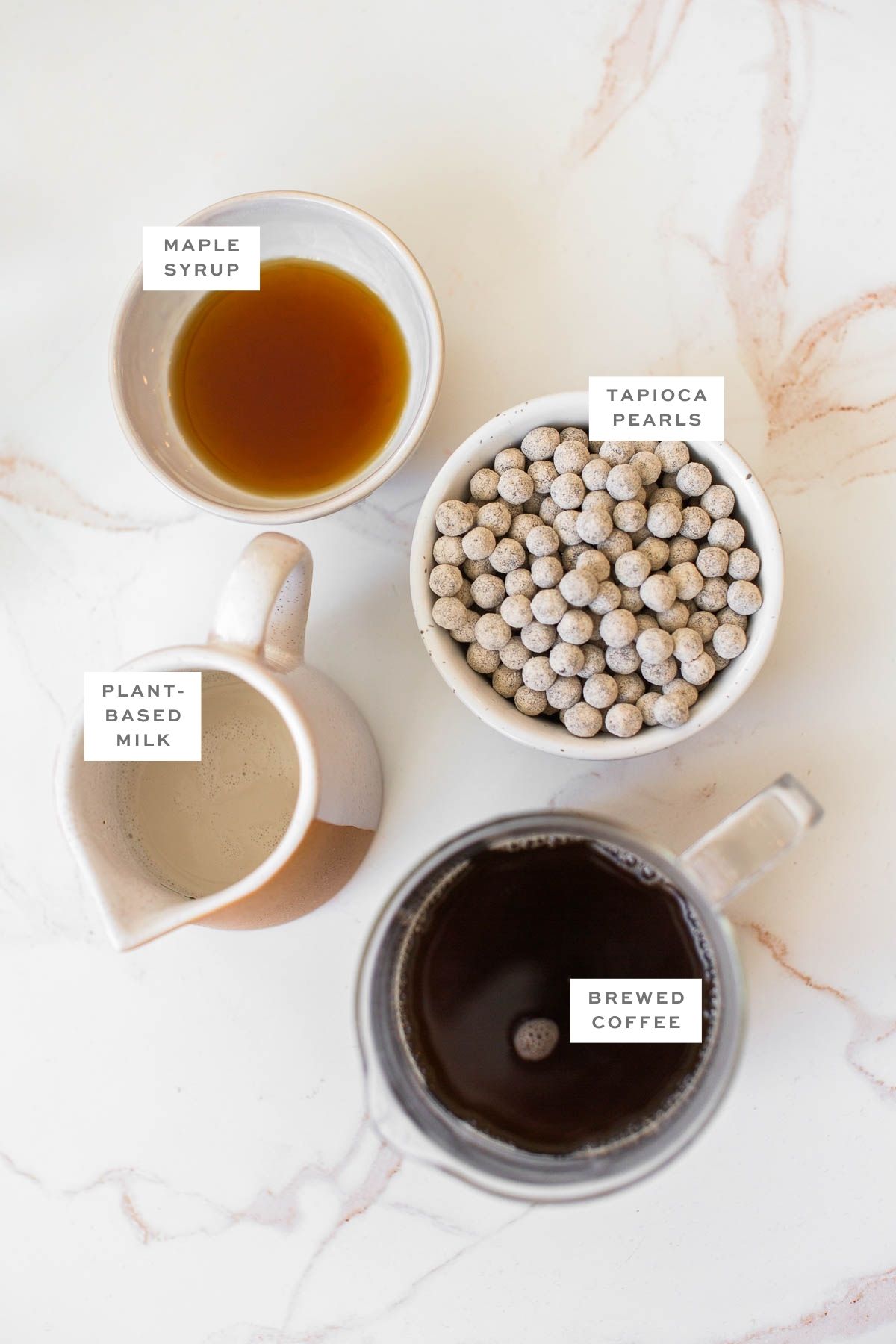 Ingredients for making boba coffee with labels.