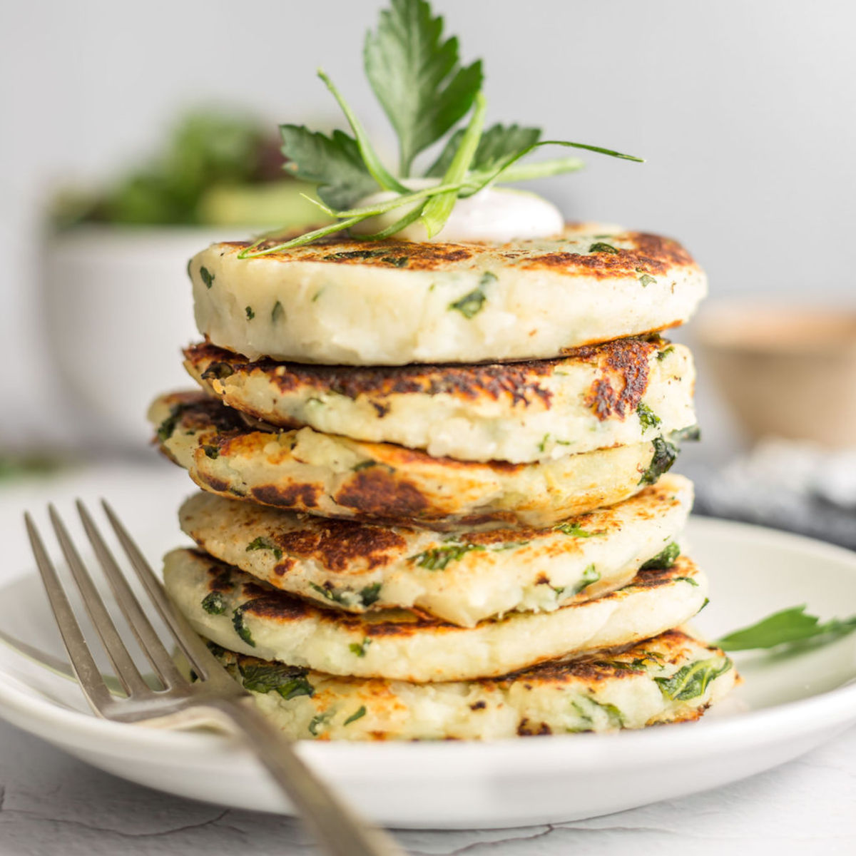 A stack of vegan potato pancakes on a plate.