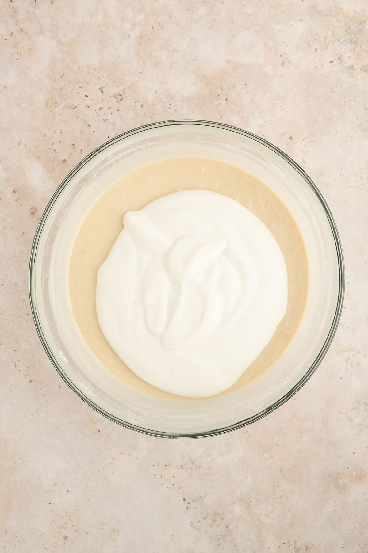 Sponge cake batter fully mixed and ready to pour into baking pans.
