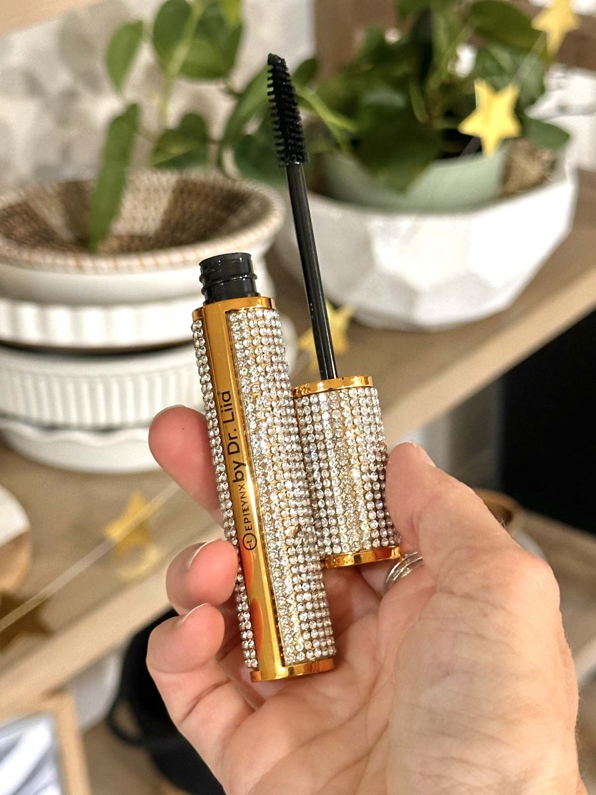 hand holding vegan mascara by Epilynx by Dr. Liia