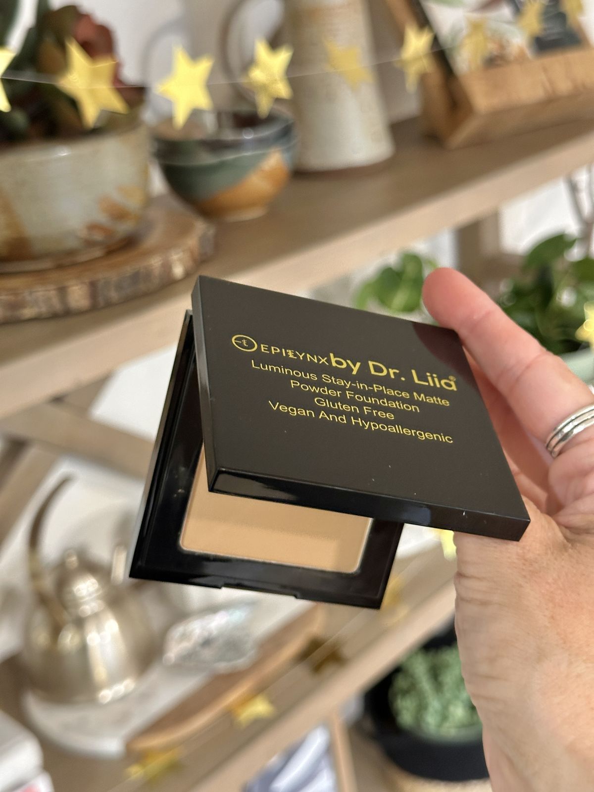 hand holding vegan foundation by Epilynx by Dr. Liia