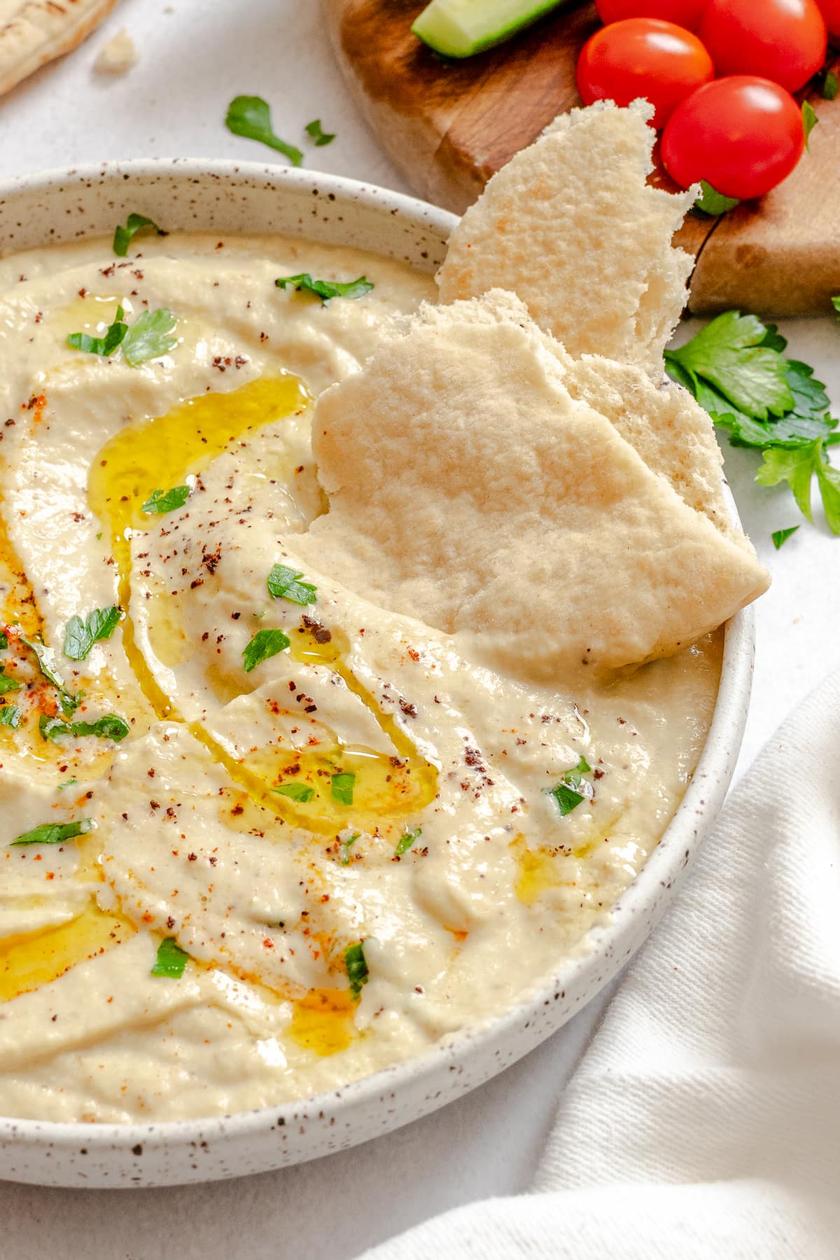 Roasted baba ganoush eggplant dip served in a bowl with pita bread.