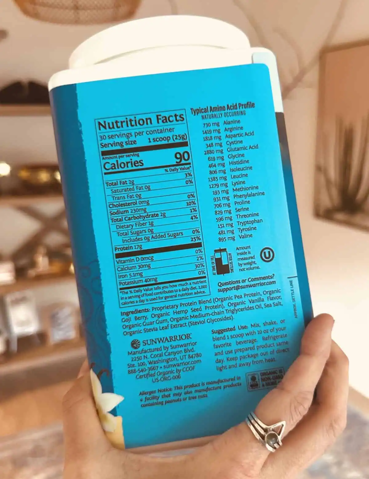The ingredient label on the back of a container of vanilla vegan sunwarrior protein powder.