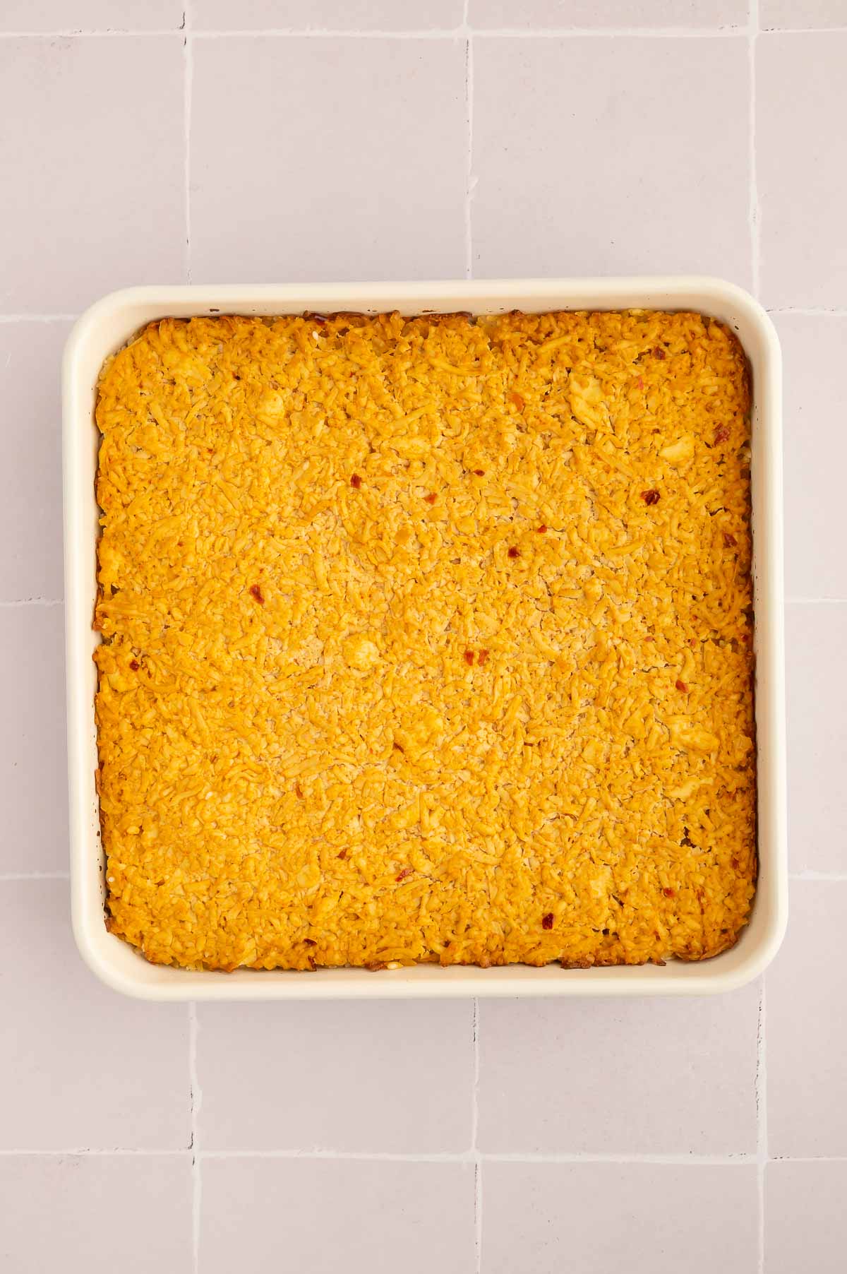 Golden sushi bake in a casserole dish right after baking.