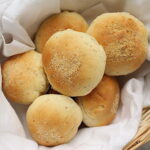 Basket of vegan pandesal rolls.