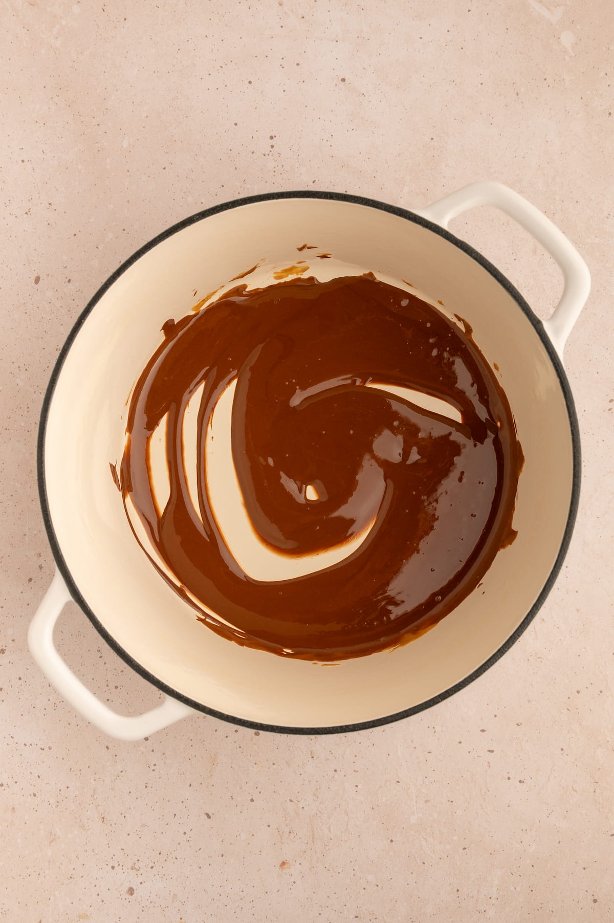 Peanut butter and vegan chocolate melted together and ready to mix with popped popcorn.
