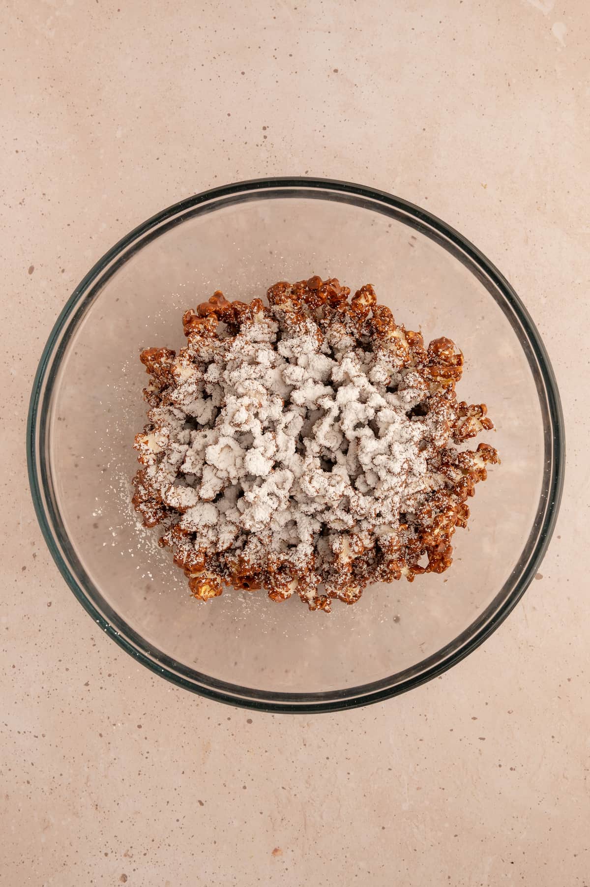 Powdered sugar added to the peanut butter and chocolate mixed popcorn.