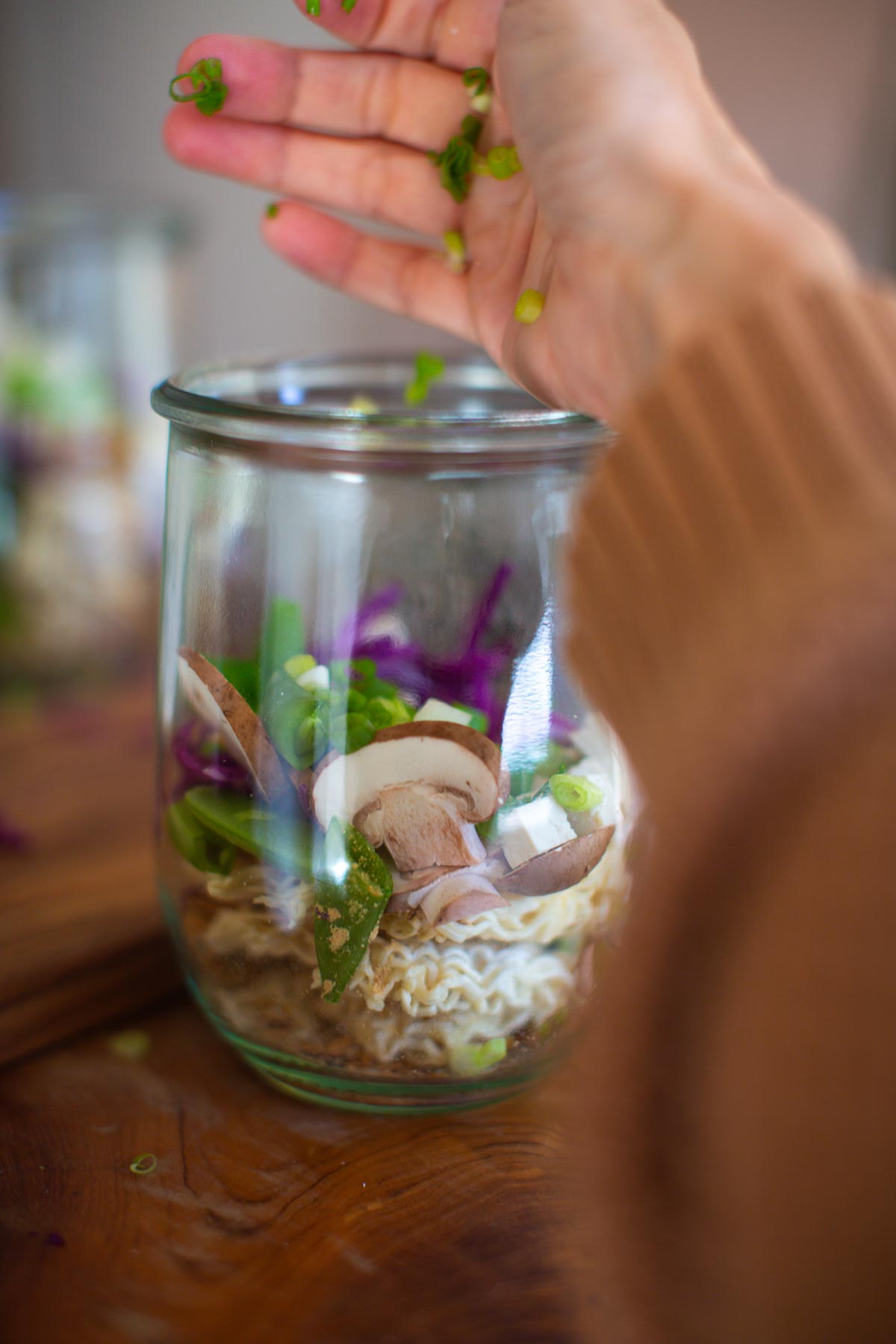 Fresh veggies added to the jar of meal prep ramen.