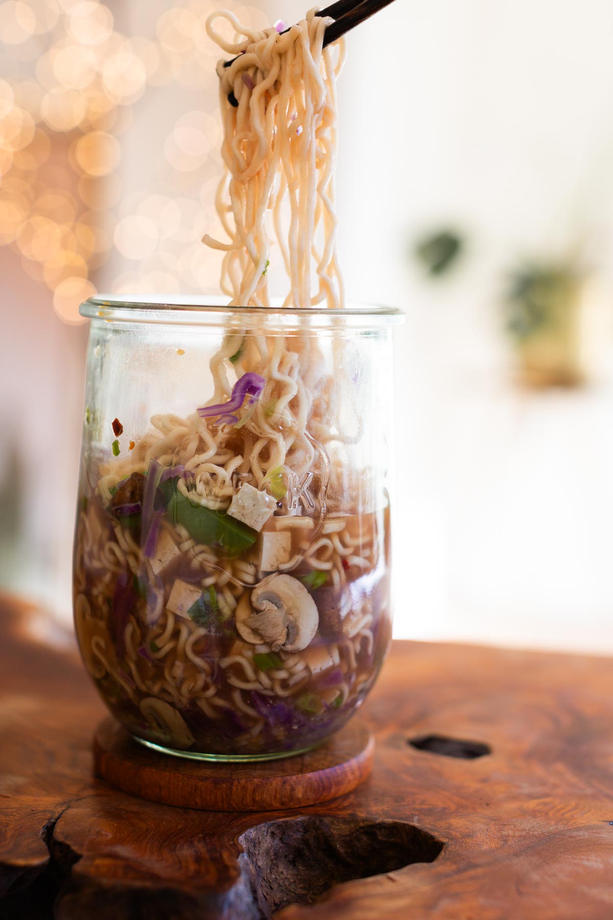 Ramen noodle jar with vegetables and tofu.