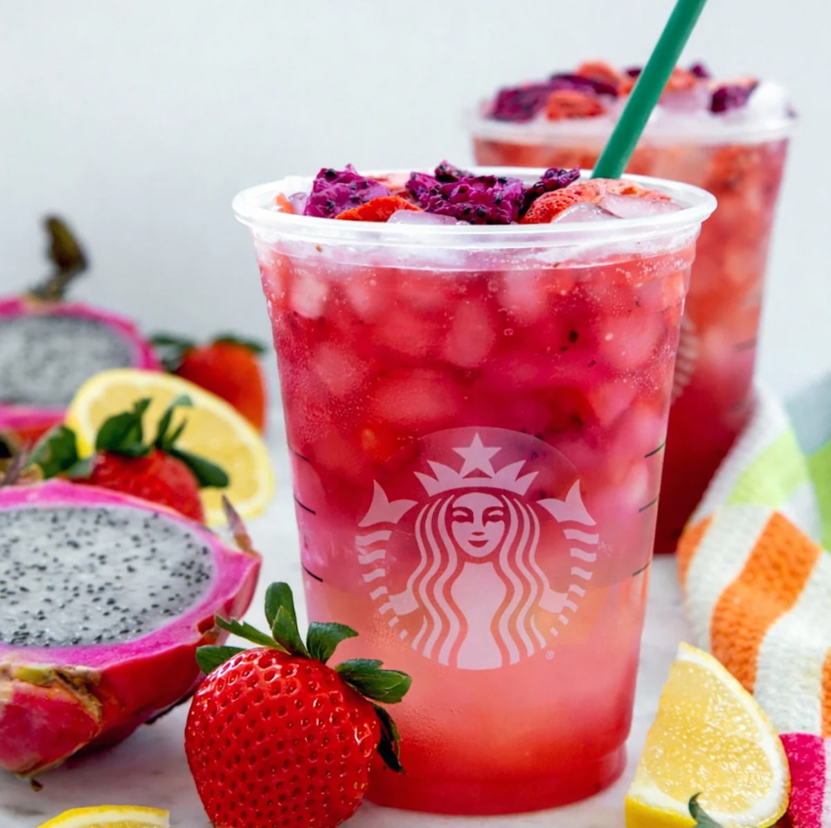 Vegan-friendly Starbucks Cannon Ball Drink with mango dragonfruit, strawberry acai and freeze-dried strawberries and dragonfruit pieces.