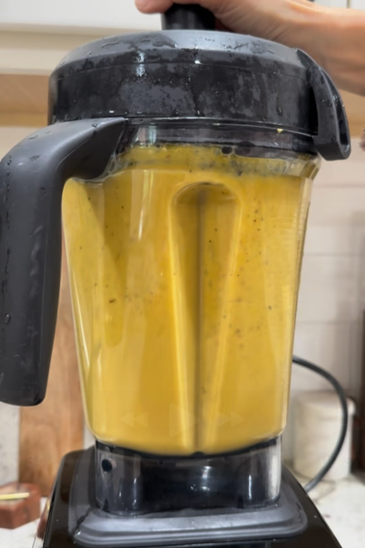 Kabocha squash soup blended smoothly in a blender pitcher.