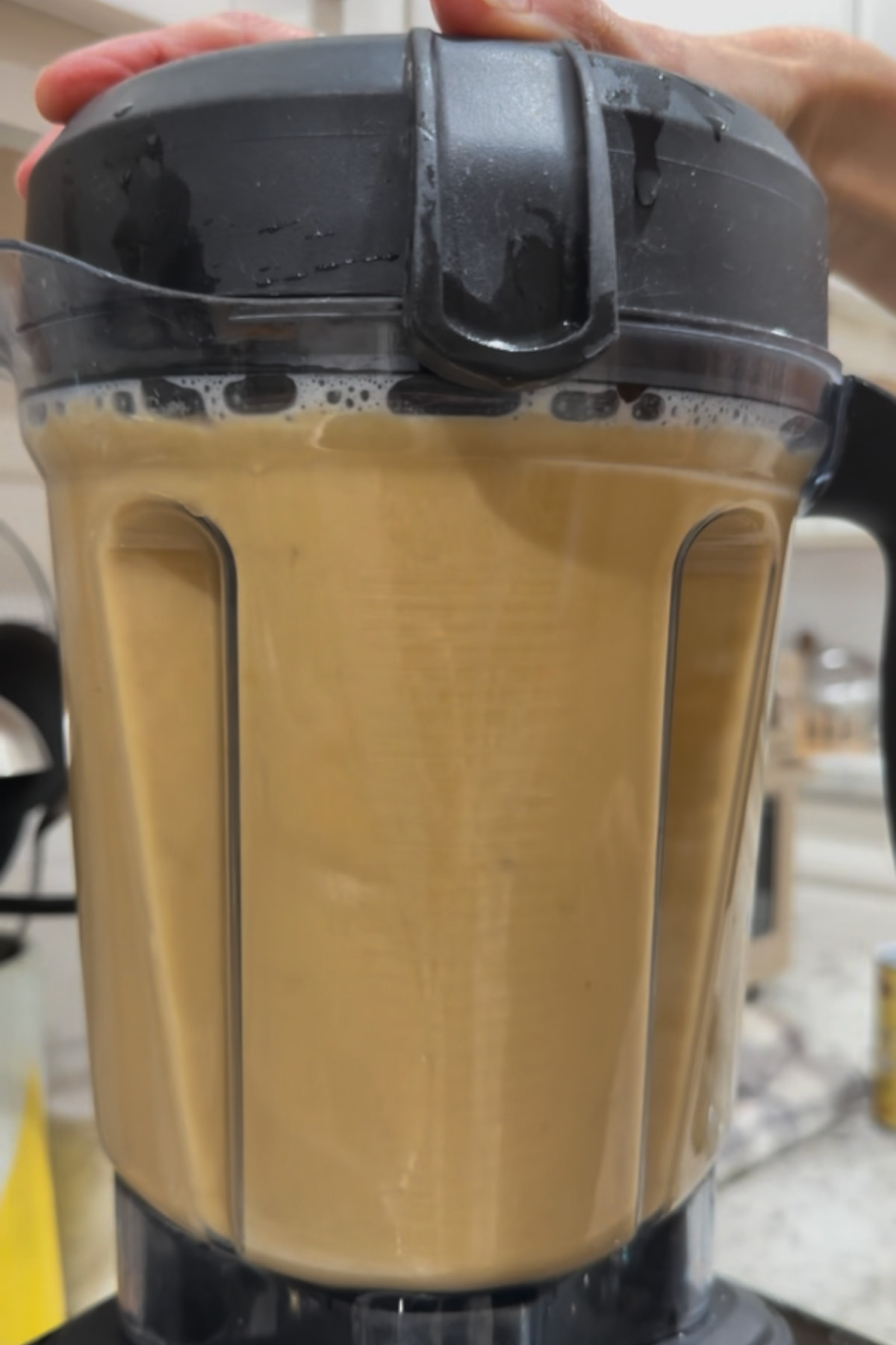 Roasted butternut squash soup blended smooth in a blender.