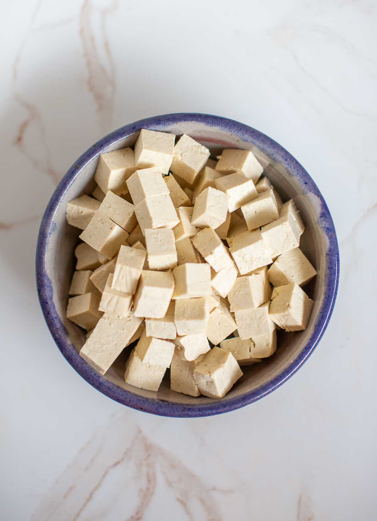 Cubed extra firm tofu for a yellow curry with tofu dish.