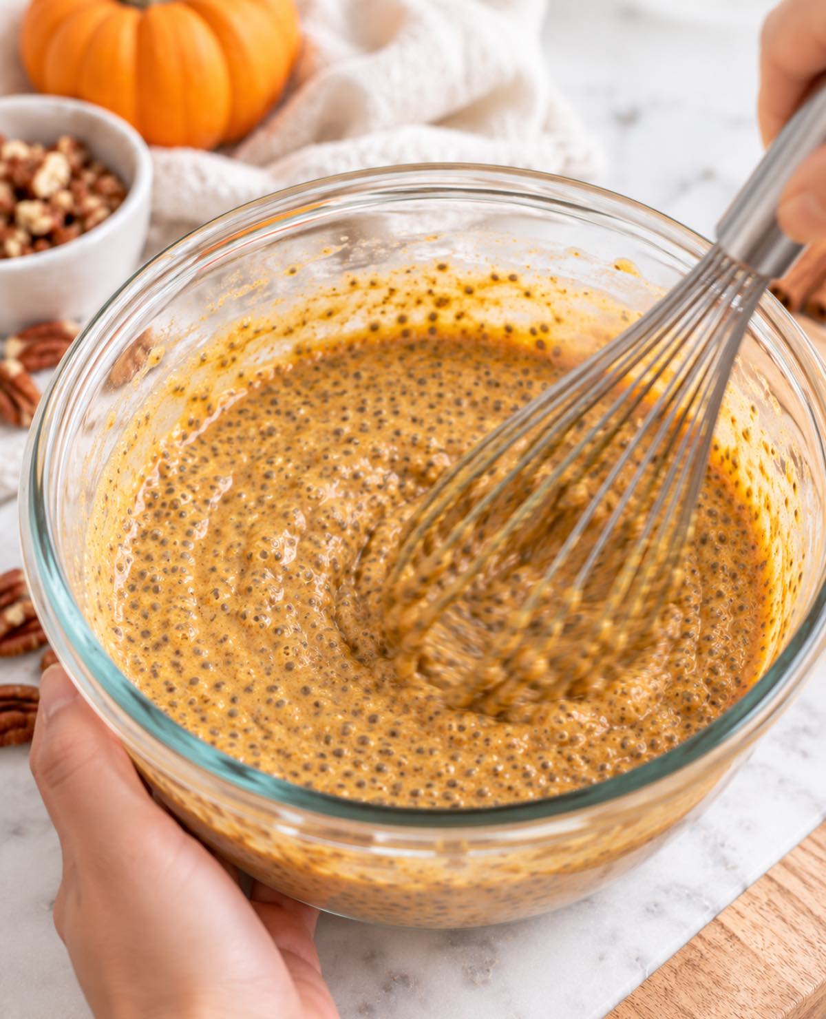 Whisking the thickened pumpkin spice chia seed pudding.